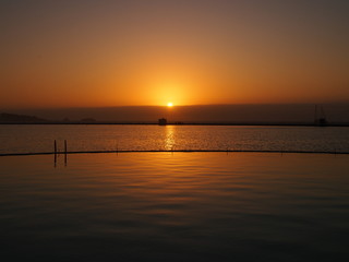 Fototapeta na wymiar Sunset in the World's Biggest Pool, San Alfonso del Mar, Algarrobo, Chile