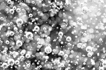 Blurred black and white background. Macro Oxygen bubbles in water.  Concept such as ecology