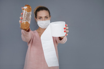 Woman in a mask with buckwheat and toilet paper