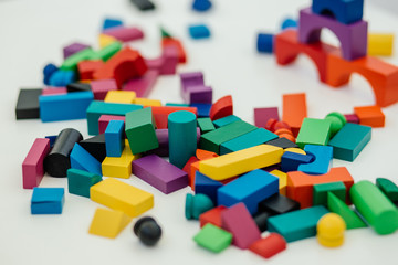 Fototapeta na wymiar Multi-colored blocks of a wooden constructor. Concept of development of preschool children.