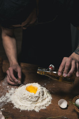 man hands kneading dough