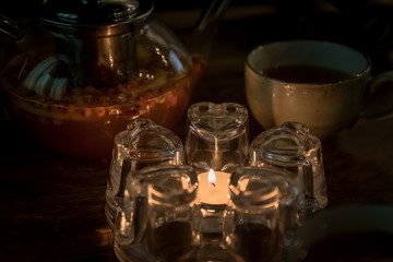 candle near the tea kettle