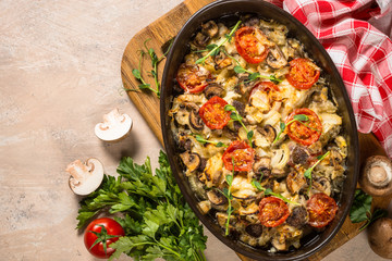 Baked meat with vegetables top view.