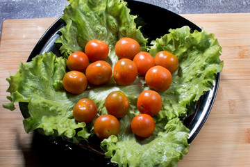Ripe red tomatoes. Preparation of vegetable salad.