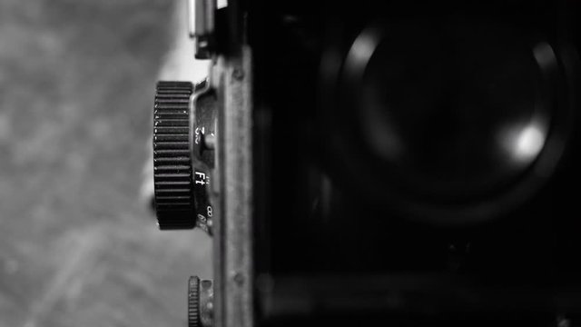 old camera on dark background in black and white