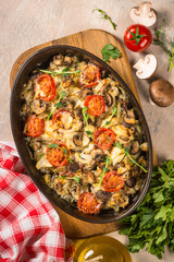 Baked meat with vegetables top view.