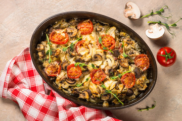 Baked meat with vegetables top view.