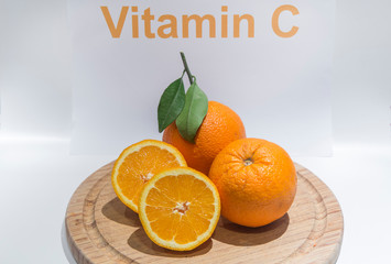 Sweet orange fruit on a cutting board,vitamin c sign