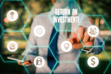 Conceptual hand writing showing Return On Investment. Concept meaning performance measure used...