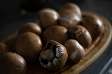 a lot of brown mushrooms king champignon in the kitchen