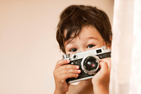 A boy of eastern appearance with a camera