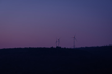 Wind energy in dawn with red ligths