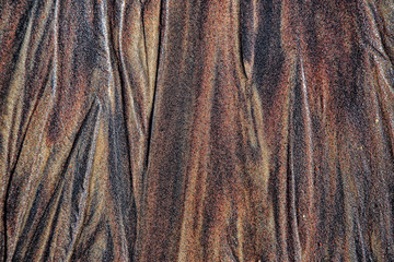 Wet sea sandstone with traces of groundwater smudges