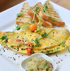 food, fried eggs with vegetables and toast on a plate