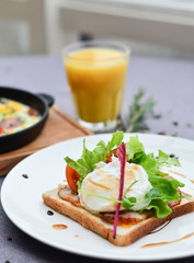 food, poached an egg on toast with vegetables on a plate