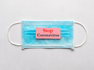 Coronavirus concept with medical mask and sign Stop Coronavirus