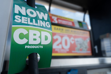 Closeup of CBD product sign at a gas station