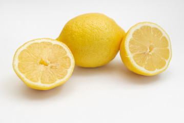 whole lemon fruit sour yellow isolated on a white background close-up and rugs on the table