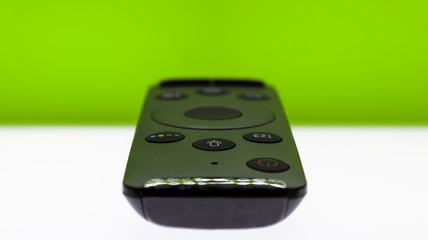 remote control on green background