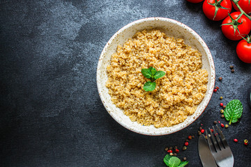 Cooked quinoa, boiled cereal porridge (healthy diet eating) keto or paleo diet
 menu concept background. top view. copy space for text