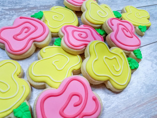 Traditional abstract flower sugar cookies on a wooden background