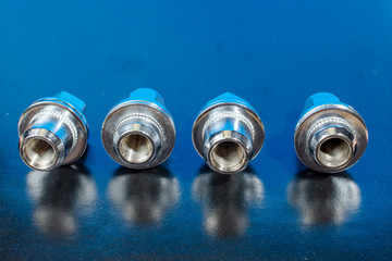 four automobile nuts for fastening a wheel
