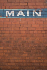 Fototapeta na wymiar word Main painted on brick wall
