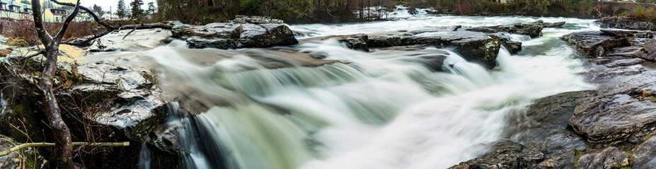 Fototapeta na wymiar Stunning natural waterfall in Killin, Highlands, Scotland