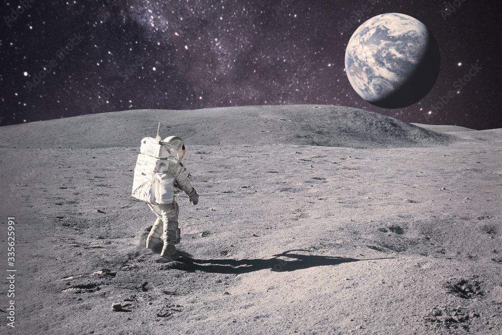 Wall mural astronaut on rock surface with space background. elements of this image furnished by nasa