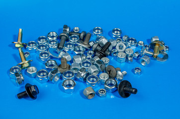 nuts and bolts for a car on a blue background