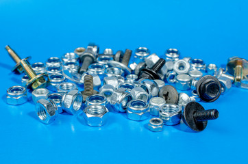 nuts and bolts for a car on a blue background