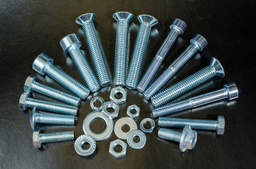 car fasteners of various sizes for repair, bolts and nuts