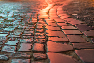 Paving stone vintage road cover. Evening road in a historical place. texture paving stones night road