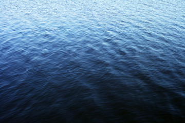Small waves on the surface of the water, lake, sea