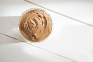 Iced frothy Dalgona Coffee, a trendy fluffy creamy whipped coffee. Korean drink latte espresso with coffee foam. made of instant coffee, sugar, hot water and milk. top view