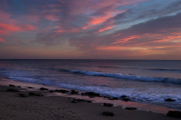 Sunrise or sunset at the beach with a colorful scky 