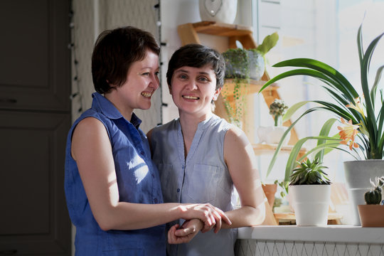 Same Sex Female Couple Taking A Selfie In Their Home