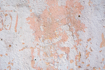 Background of old cracked pastel color paint on cement wall.