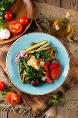 Delicious salad with various tomatoes, salad, cucumber, salad, parsley, onion. Summer salad.