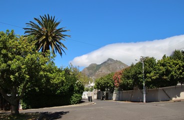 Residential street  in Cape Town, district Oranjezicht, the Signal Hill in the background. South Africa, Africa.