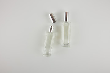 Perfume bottle with cap on white background