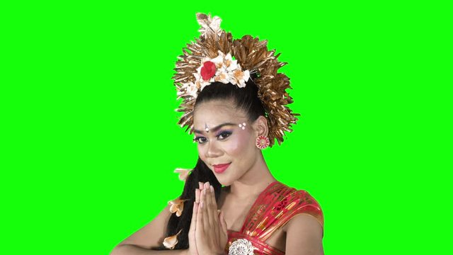 Pendet dancer shows welcoming gesture on studio