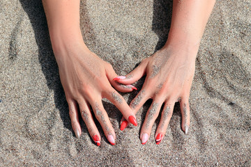 finger nails in the sand