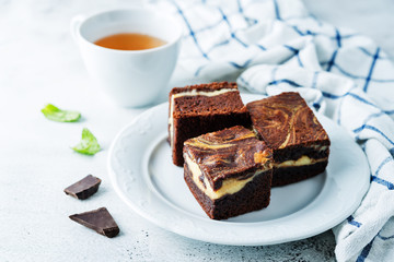 Cream cheese chocolate brownie with mint leaves
