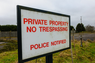 Sign advising public that this is private property, no trespassing, police notified