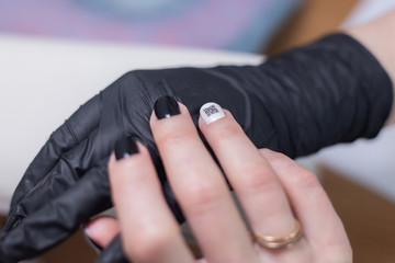 Fototapeta premium qr code manicure, female graceful hands