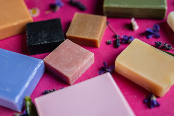 herbal antibacterial block soap bars on a hot bright pink background 