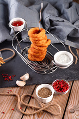 Fried breaded onion rings with beer sauce