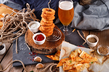 Fried breaded onion rings with beer sauce