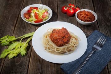Italian paste balanese stems celery tomatoes cherie salad on wooden table